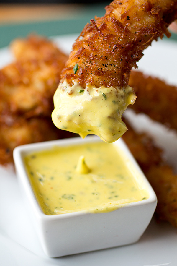 Coconut crunch chicken strips with creamy honey-mango dipping sauce
